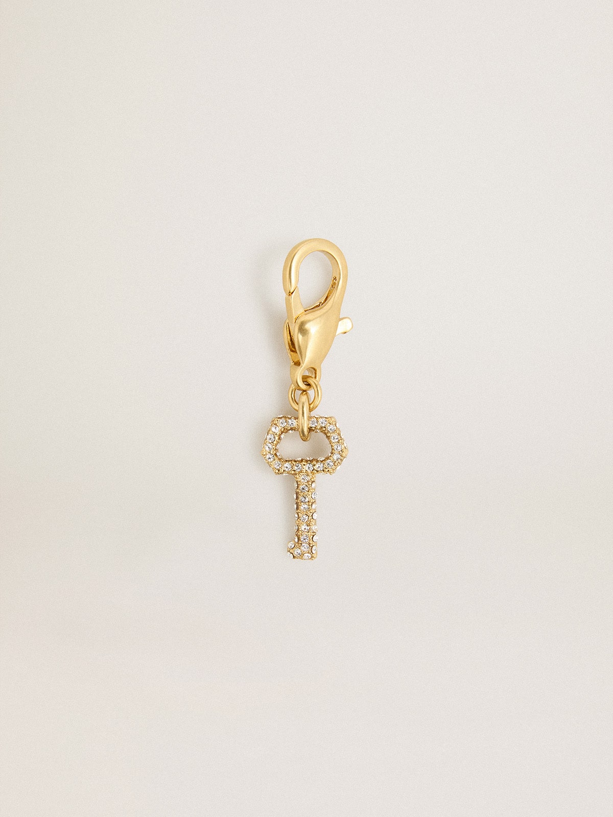 Key-shaped charm in gold-colored brass with crystals| Golden Goose