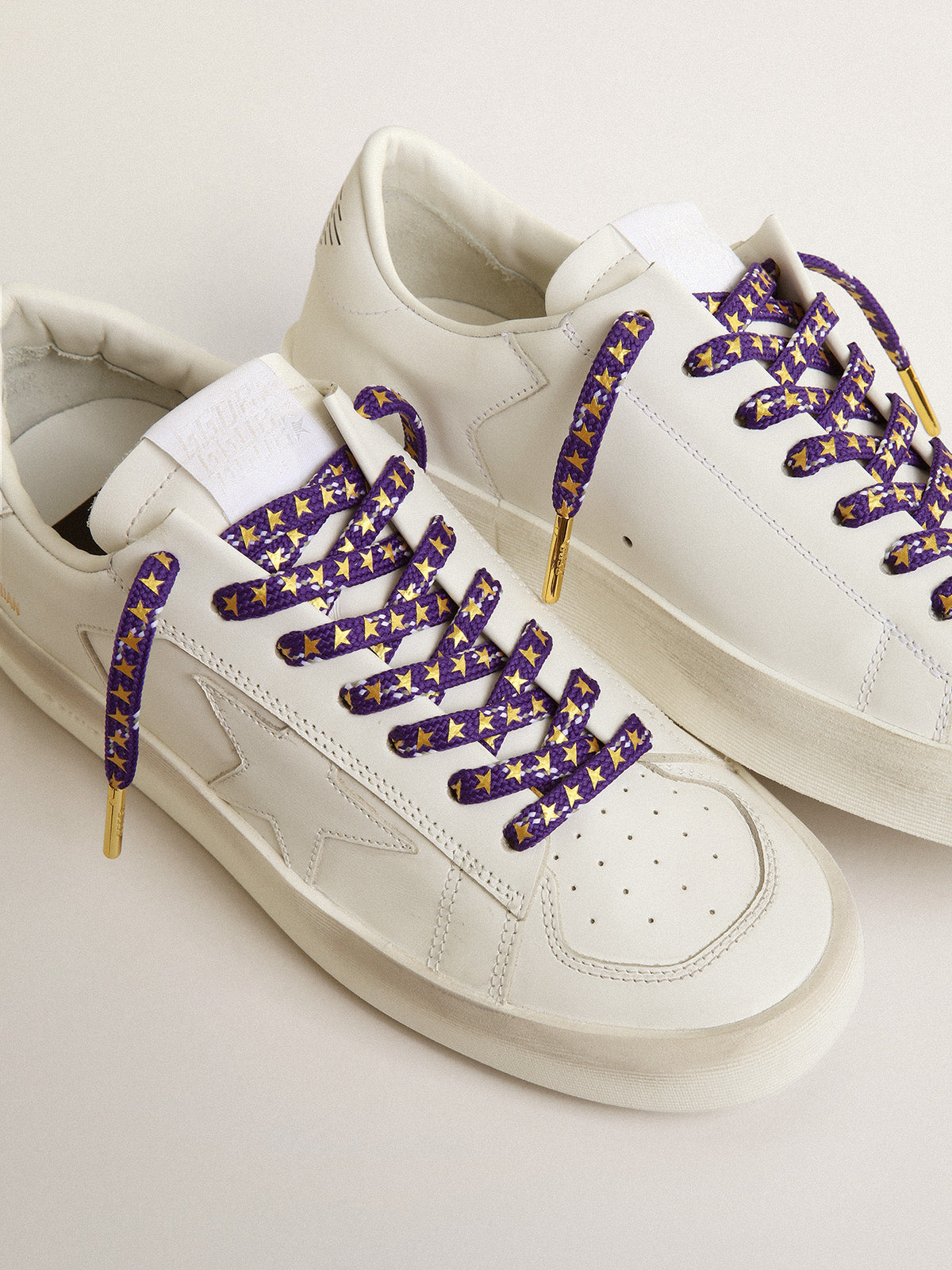 Purple laces with decorations and contrasting gold stars| Golden Goose