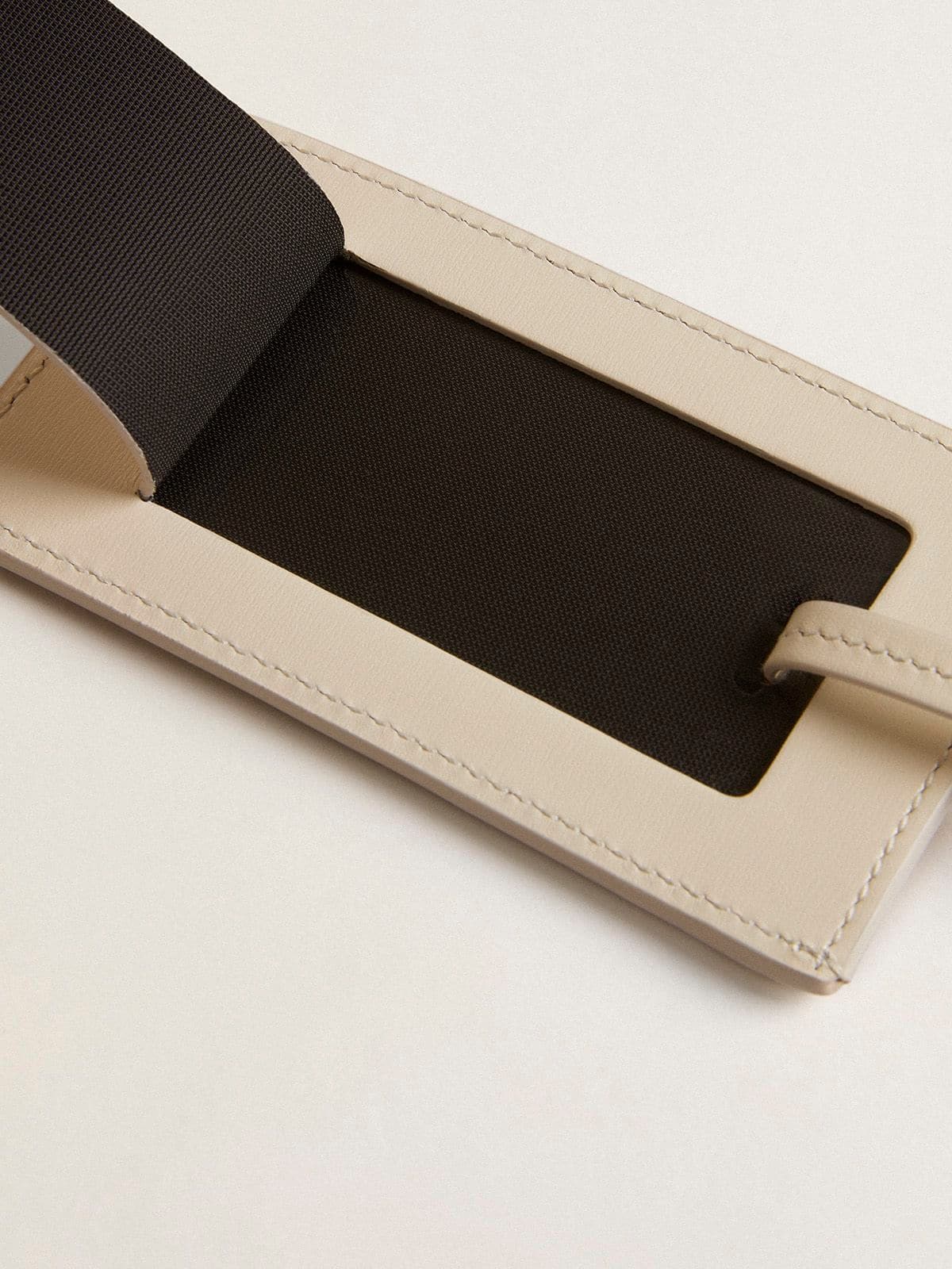 Worn white luggage tag| Golden Goose
