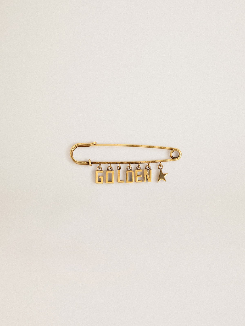 Pin in antique gold color with drop Golden lettering| Golden Goose