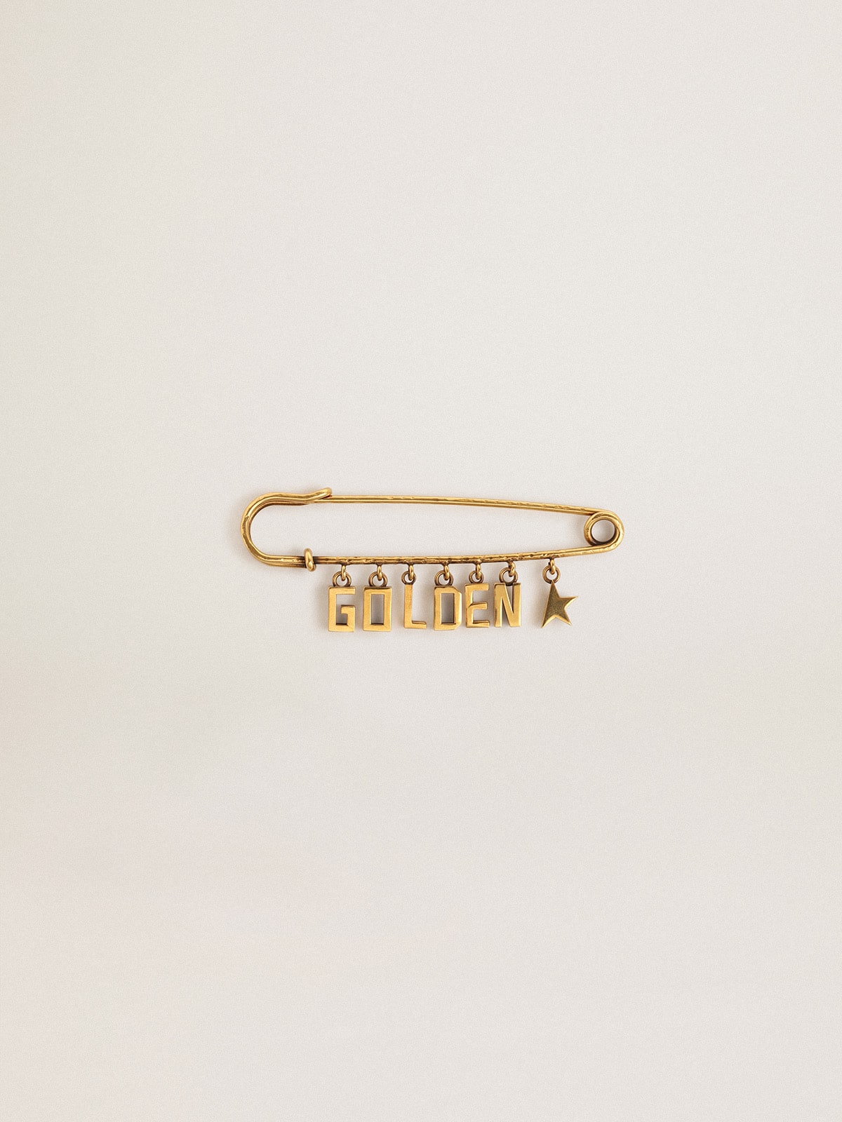 Pin in antique gold color with drop Golden lettering| Golden Goose