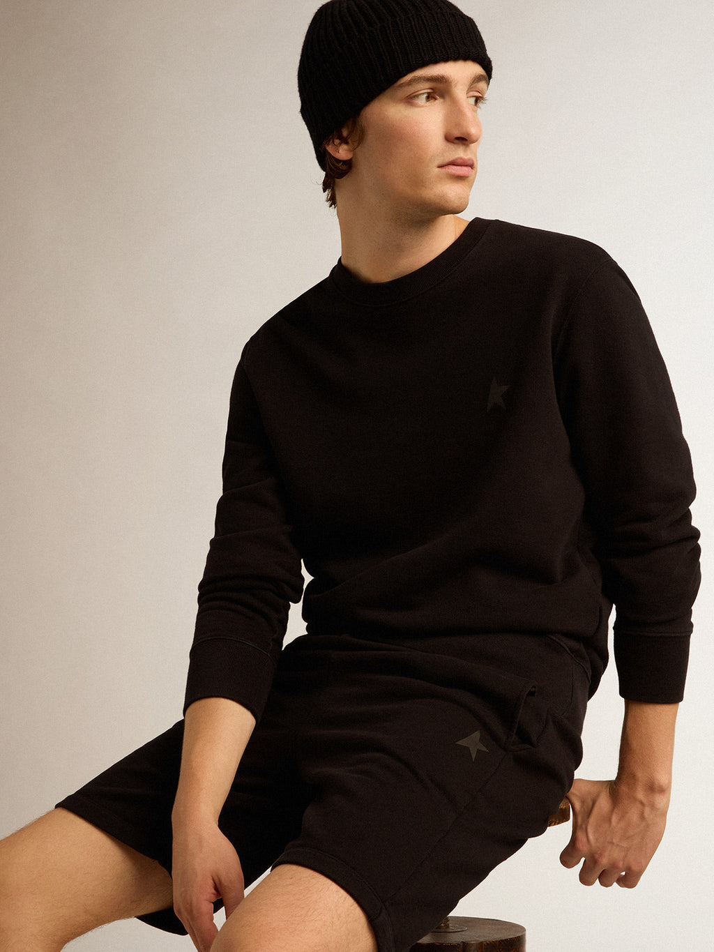 Black Archibald Star Collection sweatshirt with tone-on-tone star on the front| Golden Goose