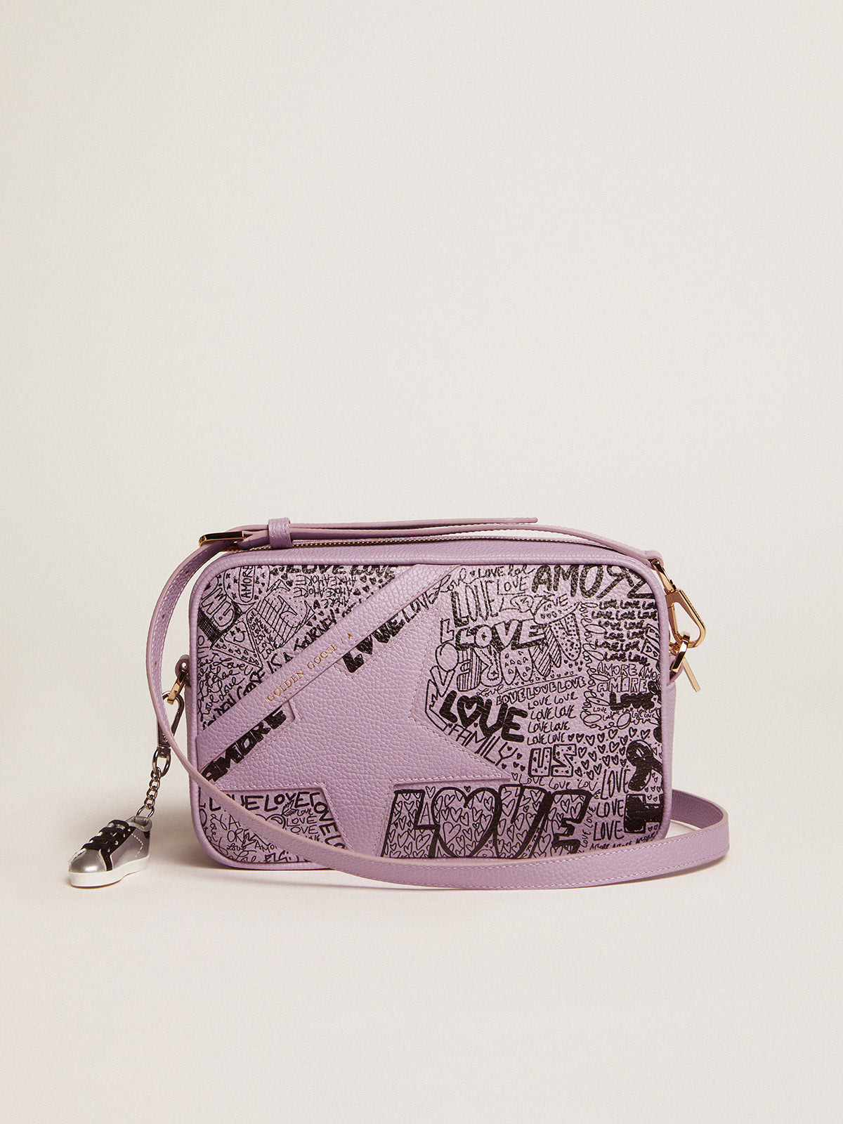Lilac hammered leather Star Bag with tone-on-tone leather star and black all-over graffiti print| Golden Goose