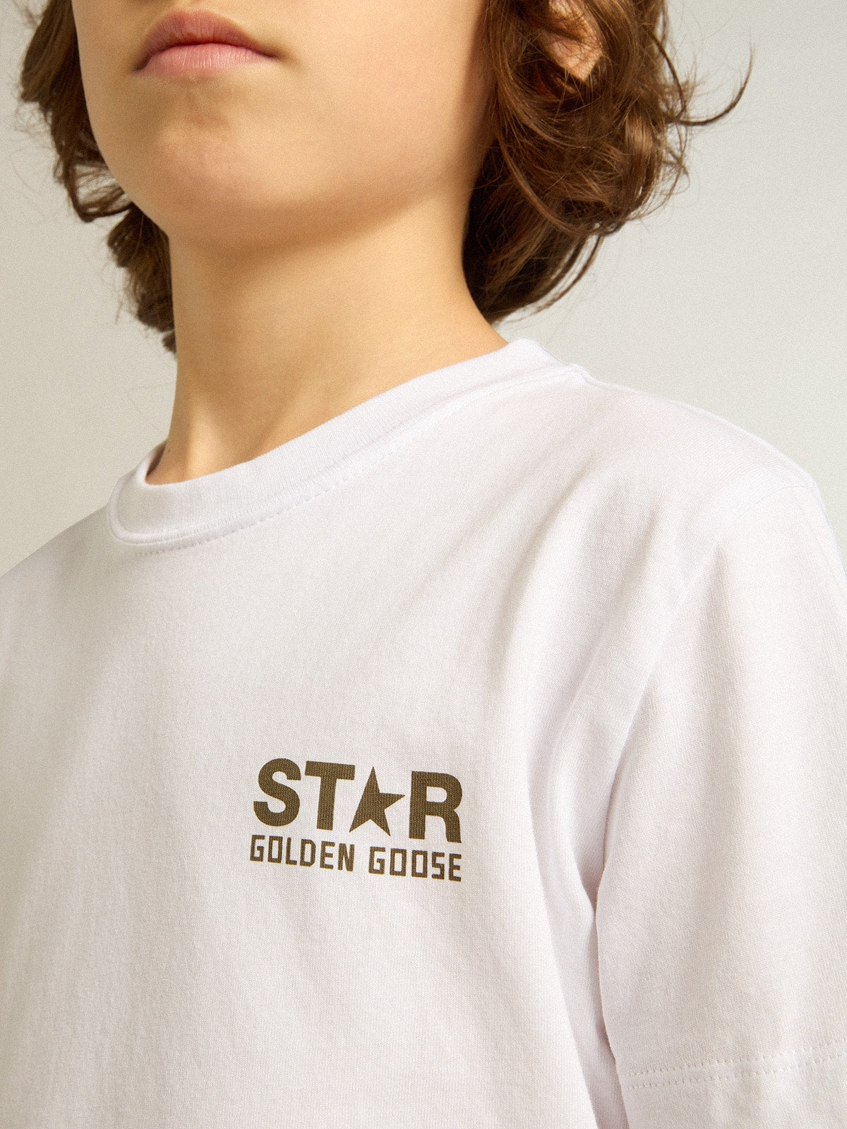 Boys' white T-shirt with contrasting dark green logo and star| Golden Goose