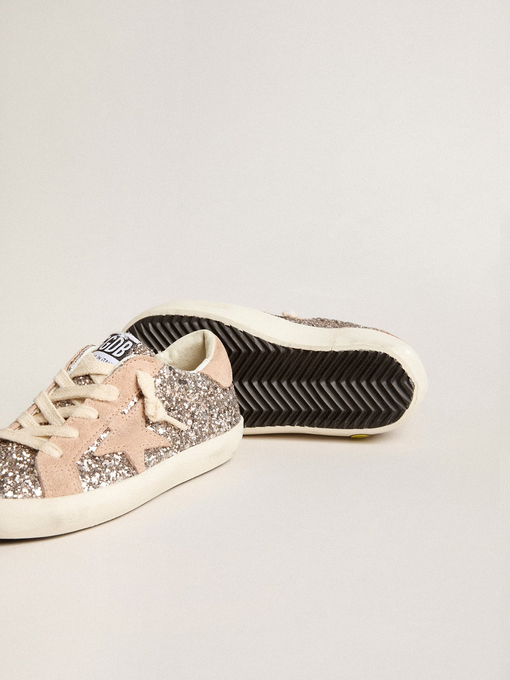 Young Super-Star in glitter with suede star and heel tab| Golden Goose