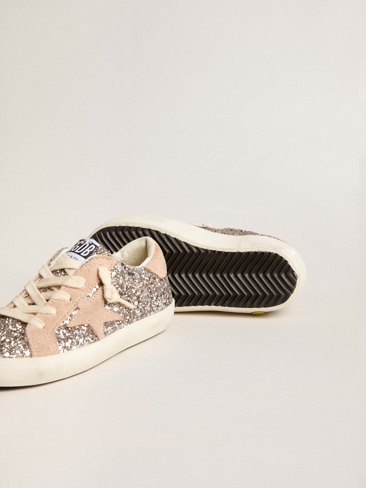 Young Super-Star in glitter with suede star and heel tab| Golden Goose
