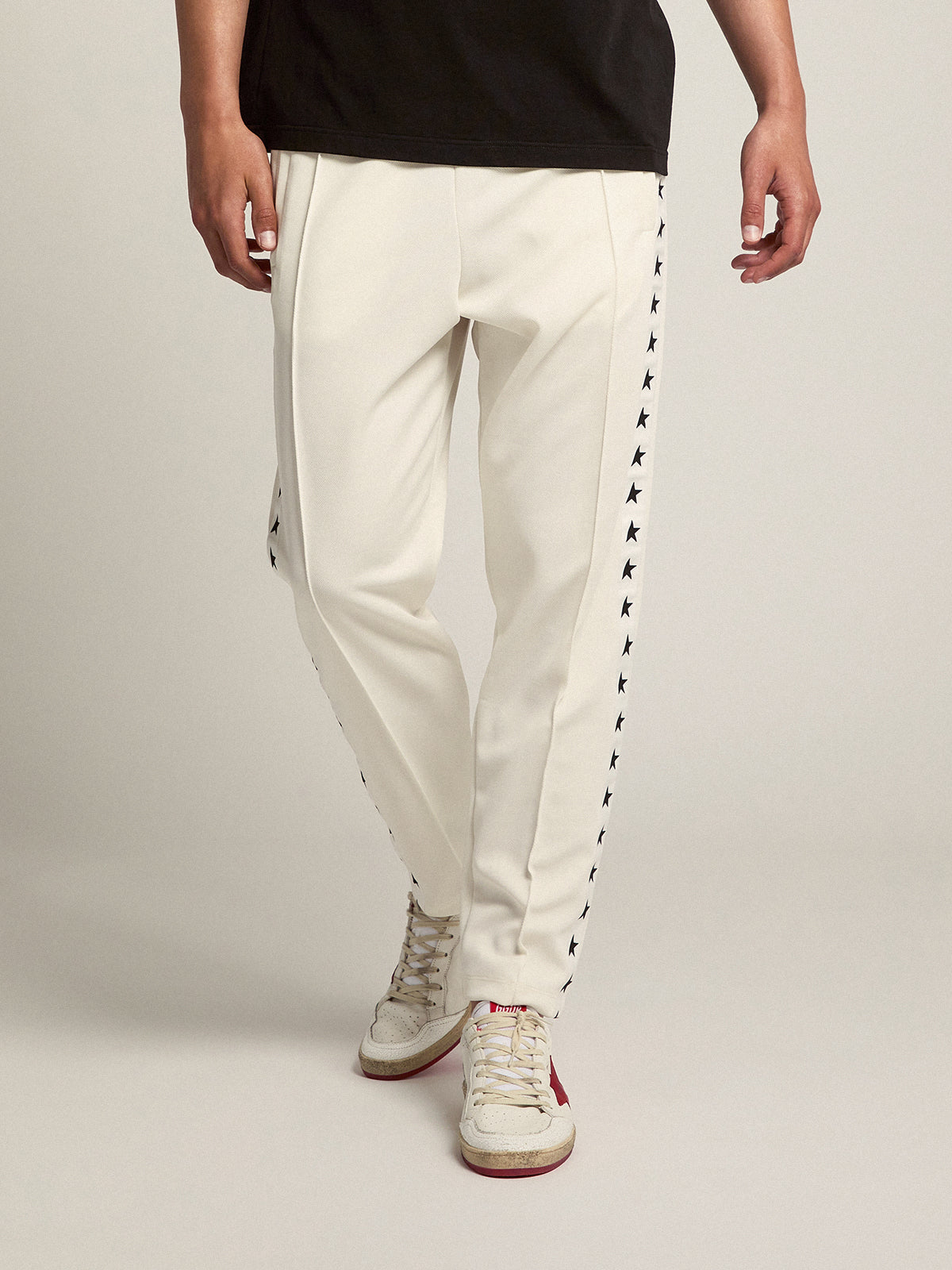 Men's white joggers with black stars on the sides| Golden Goose