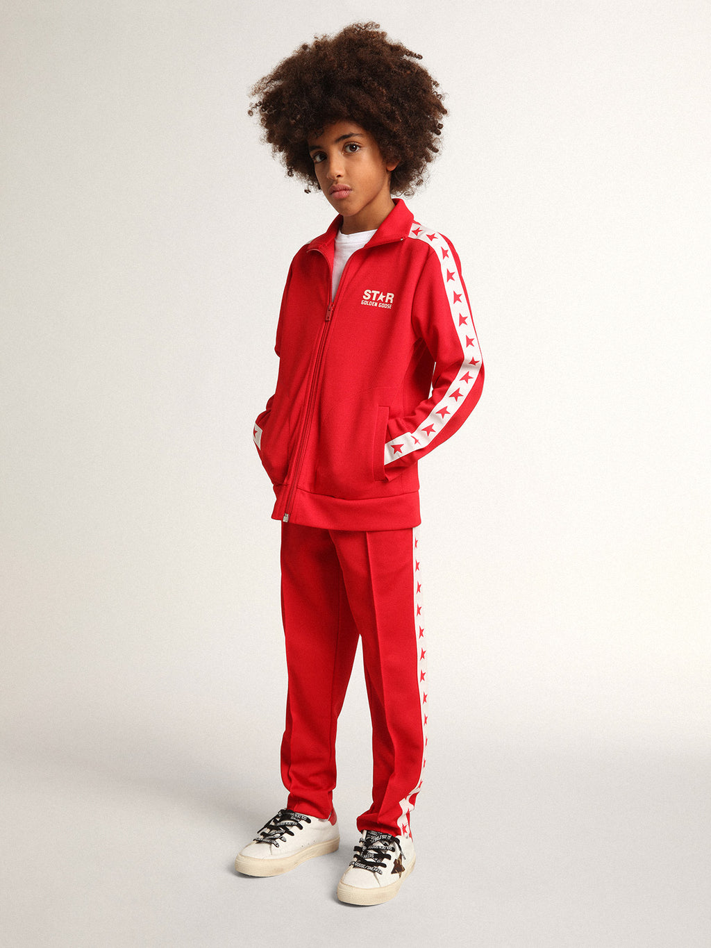 Red joggers with white stripe with contrasting red stars| Golden Goose