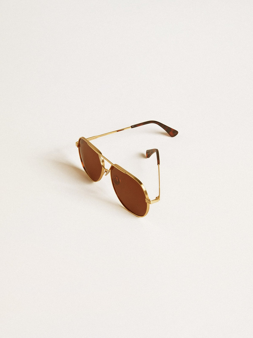 Aviator style sunglasses with gold frame and brown lenses| Golden Goose
