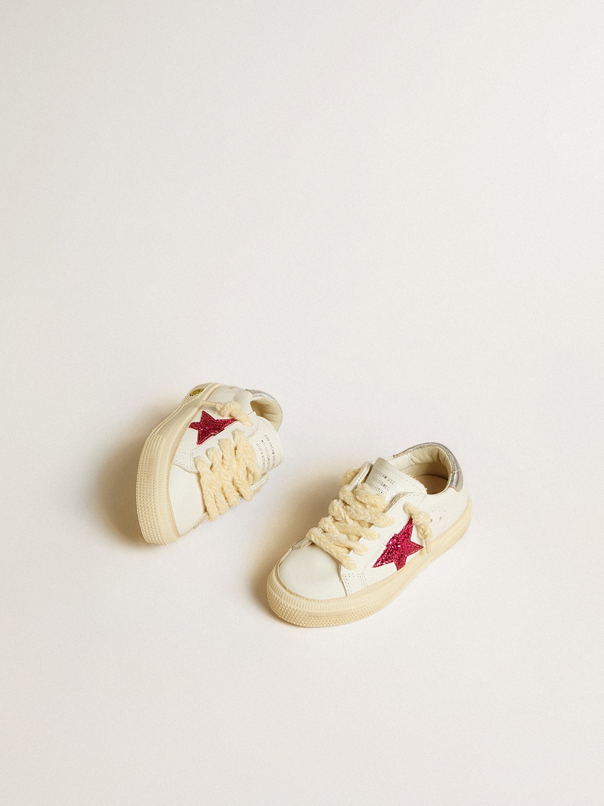 May Young with fuchsia glitter star and metallic leather heel tab| Golden Goose