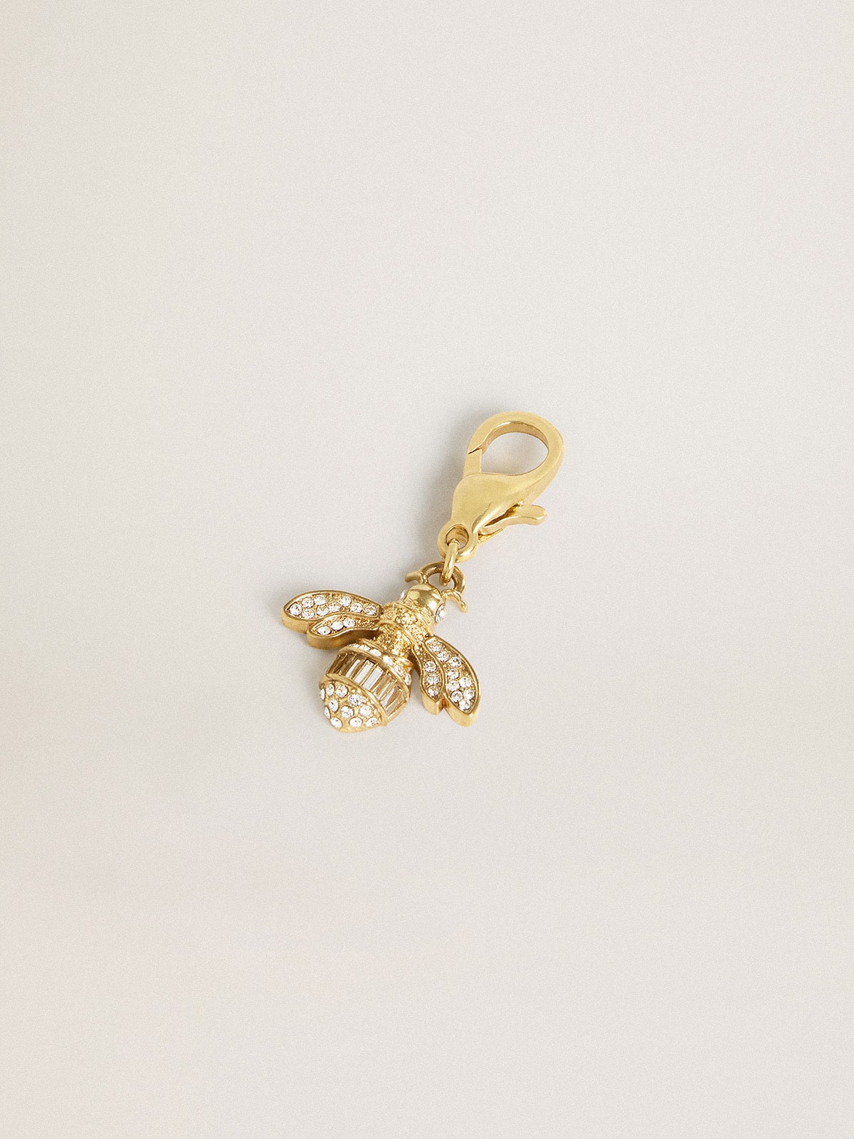 Bee-shaped charm in gold-colored brass with crystals| Golden Goose