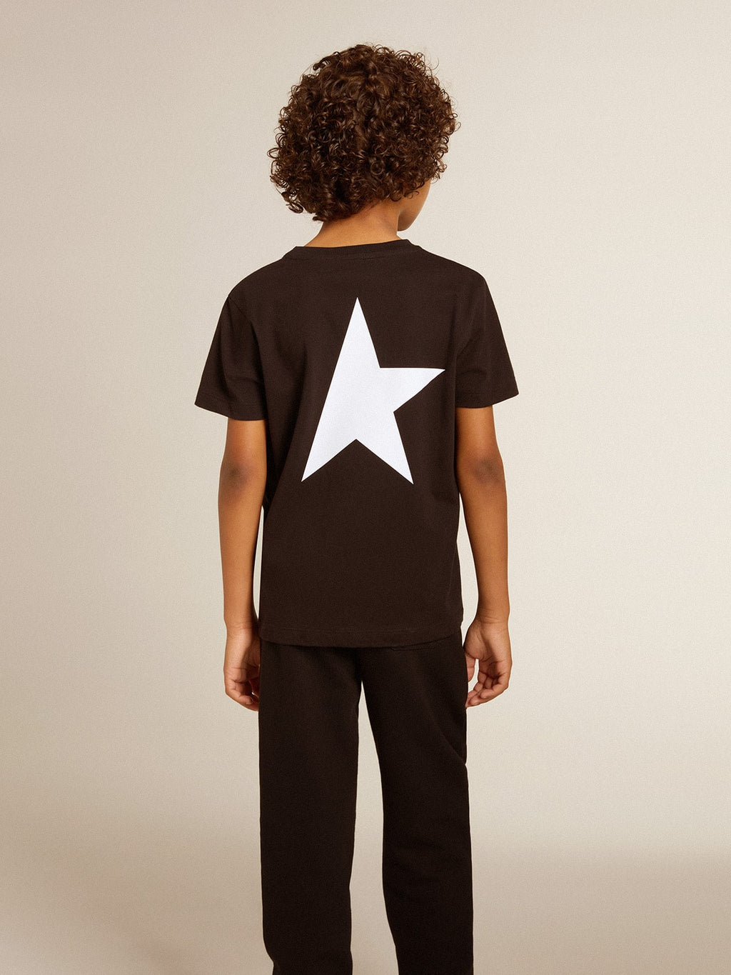 Black T-shirt with contrasting white logo on the front and maxi star on the back| Golden Goose