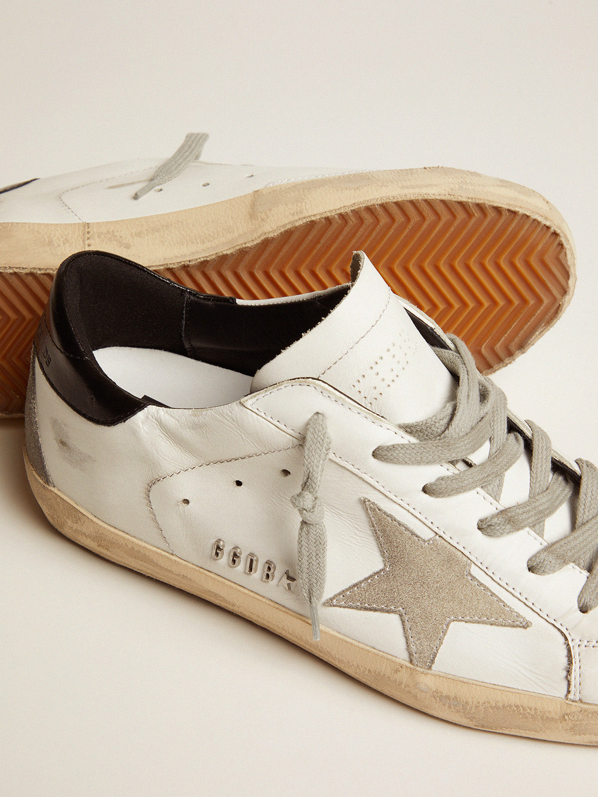 Women's Super-Star with black heel tab and metal stud lettering| Golden Goose
