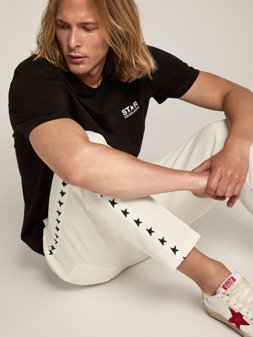 Men's black T-shirt with contrasting white logo and star| Golden Goose