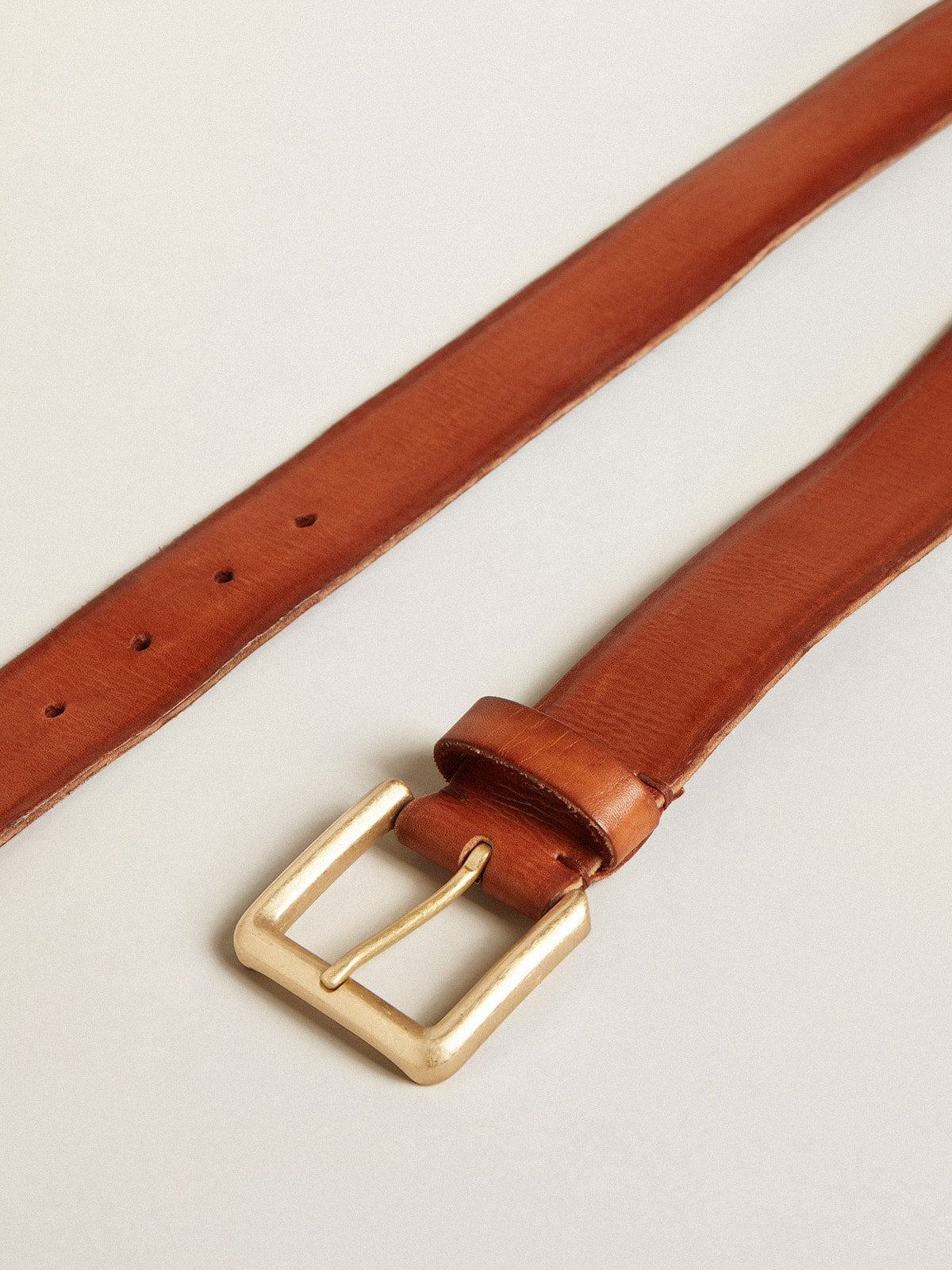 Belt in tan-colored washed leather with raised print| Golden Goose