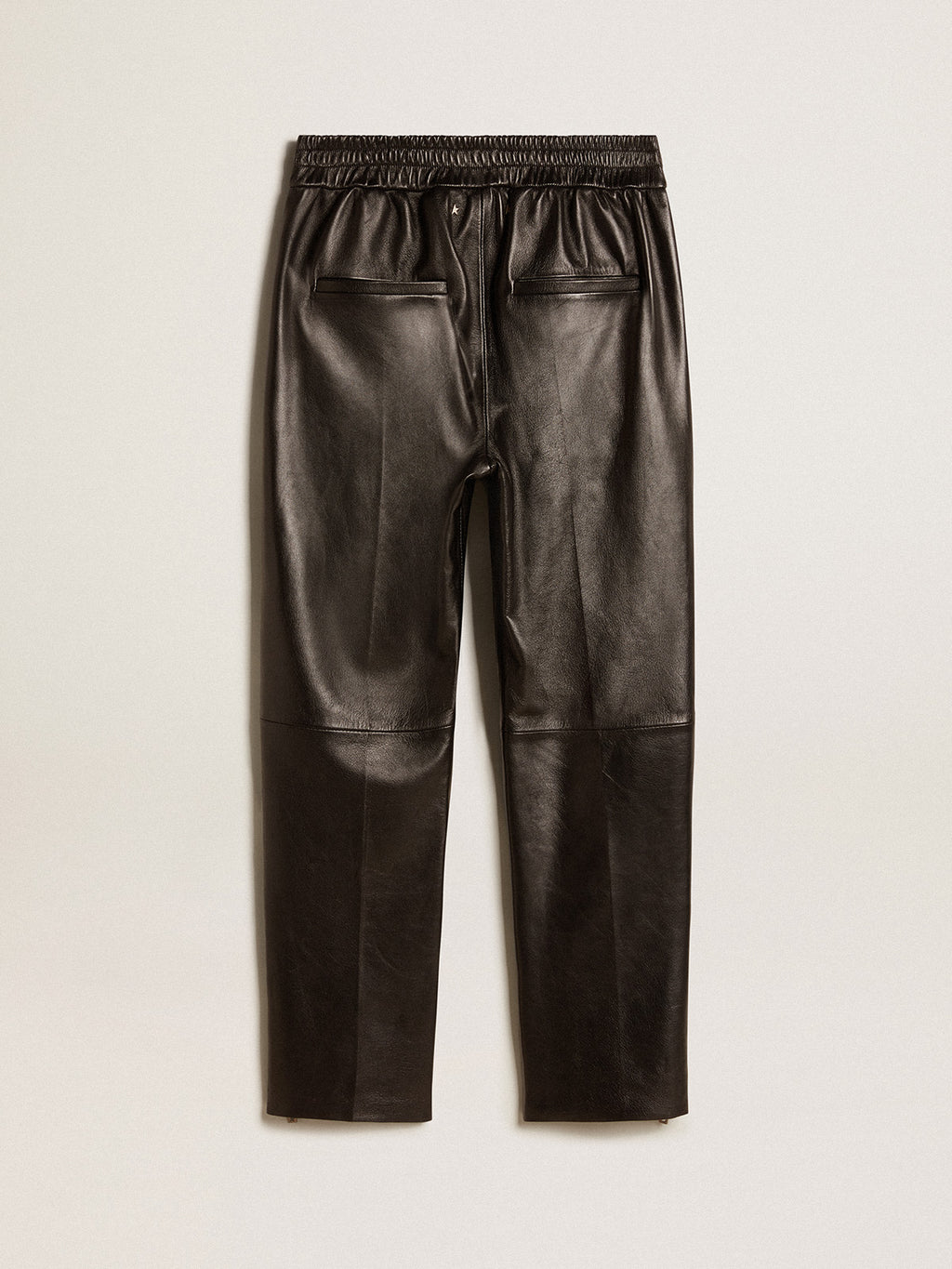 Black joggers in nappa leather with zip at the base| Golden Goose