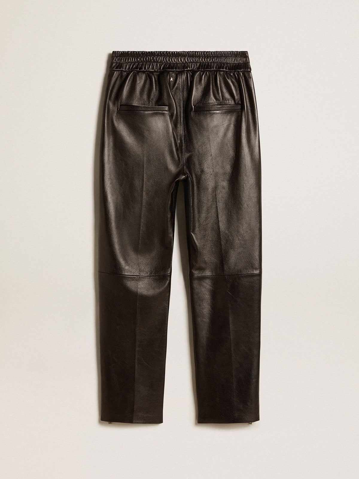 Black joggers in nappa leather with zip at the base| Golden Goose