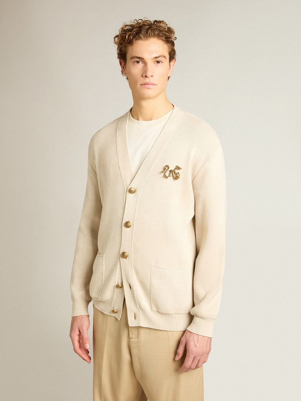 Cardigan in aged white cotton with gold button fastening
