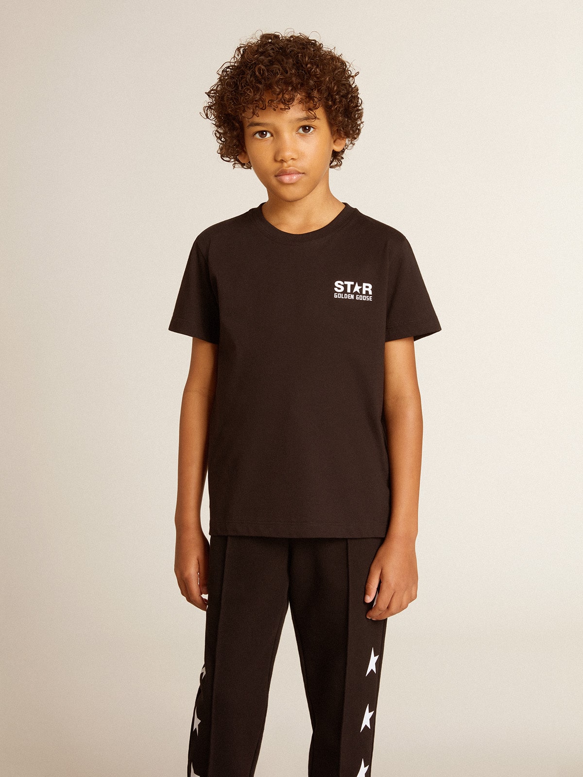 Black T-shirt with contrasting white logo on the front and maxi star on the back| Golden Goose