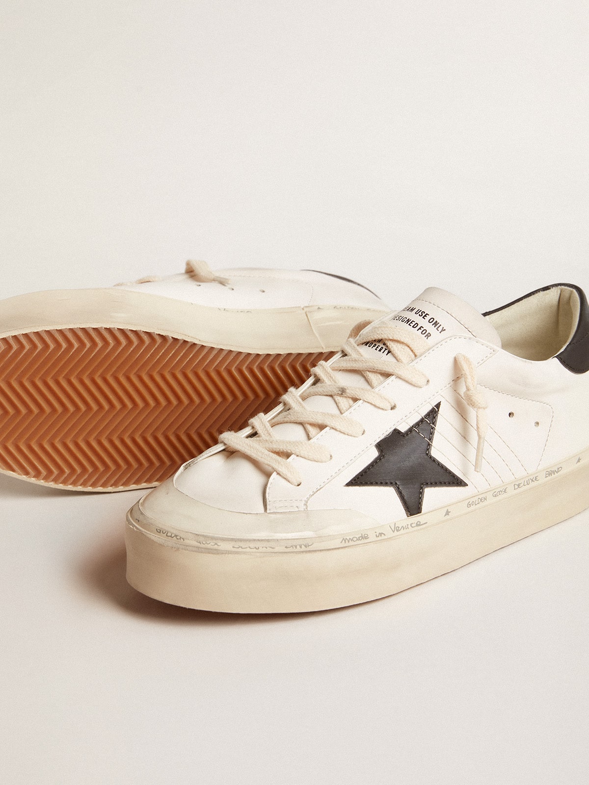 Woman's white bio-based Hi Star LTD with black bio-based star and heel tab| Golden Goose