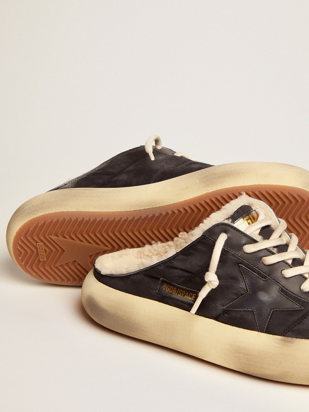 Men's Space-Star Sabot shoes in quilted black nylon with shearling lining| Golden Goose