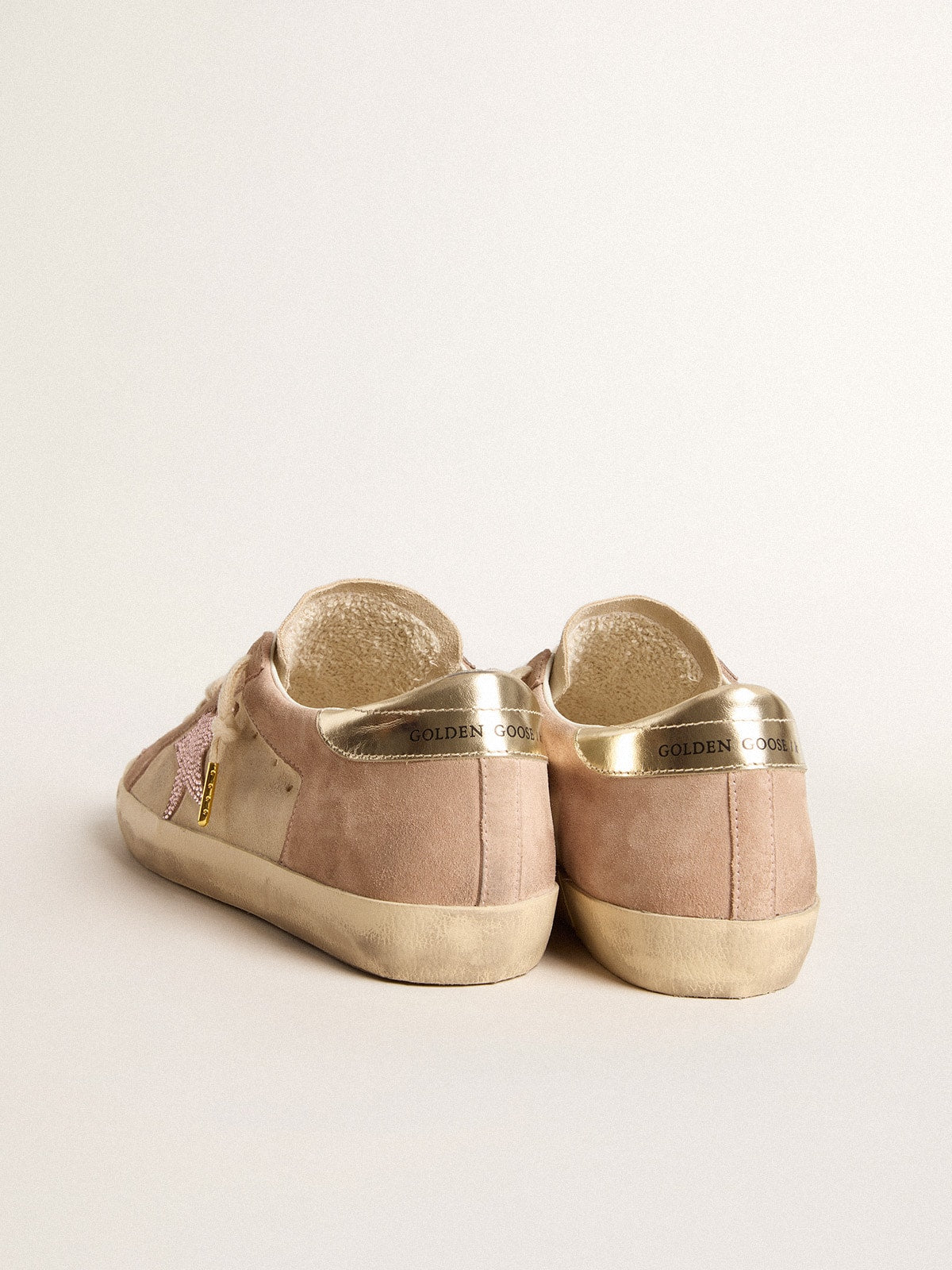 Woman's Super-Star in pale pink suede with suede star and platinum heel tab| Golden Goose