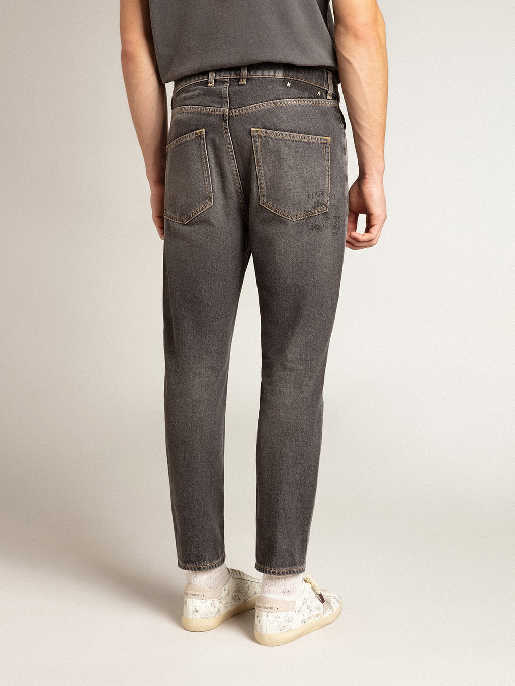 Men's black jeans with printed pocket| Golden Goose