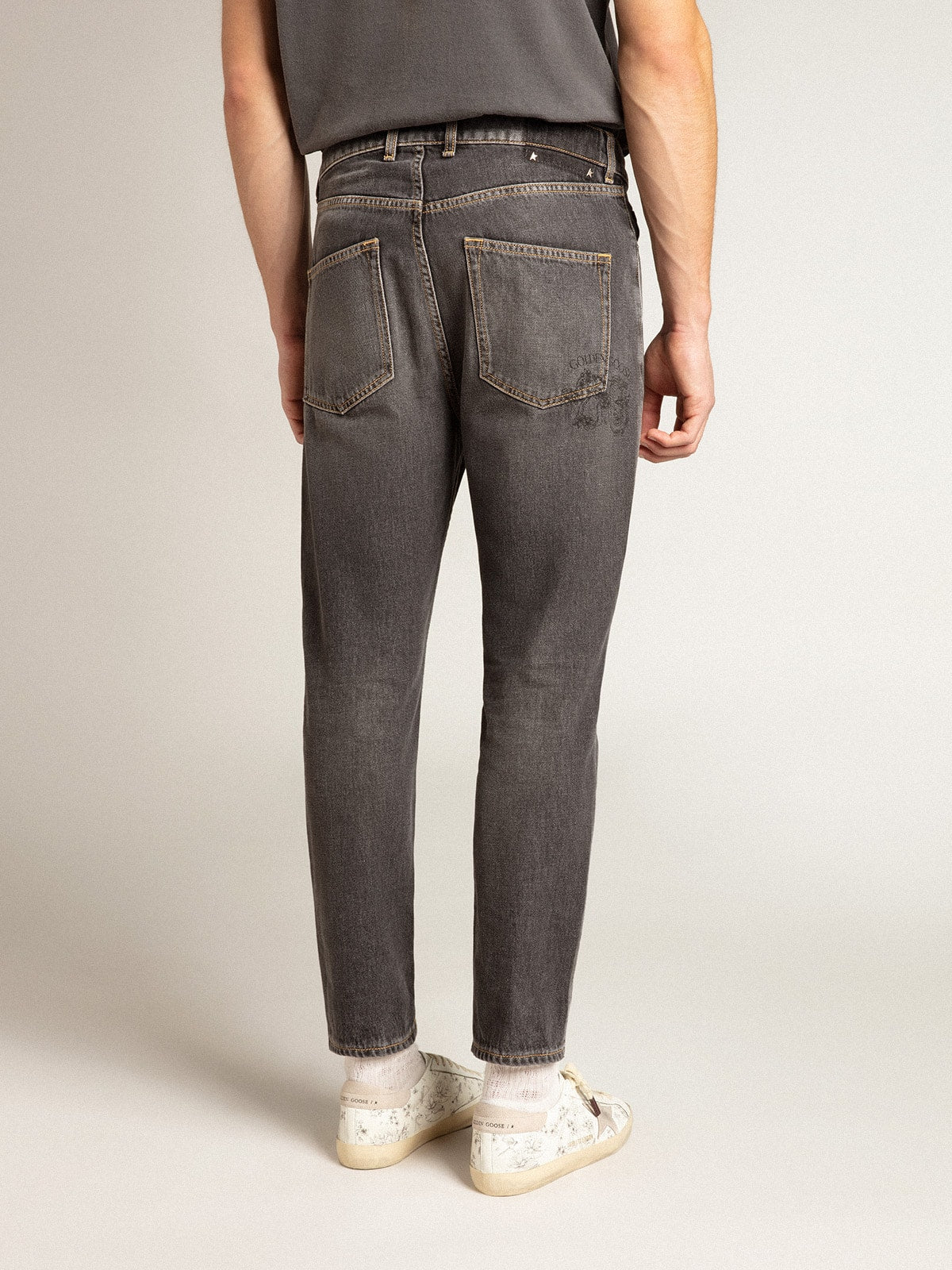 Men's black jeans with printed pocket| Golden Goose