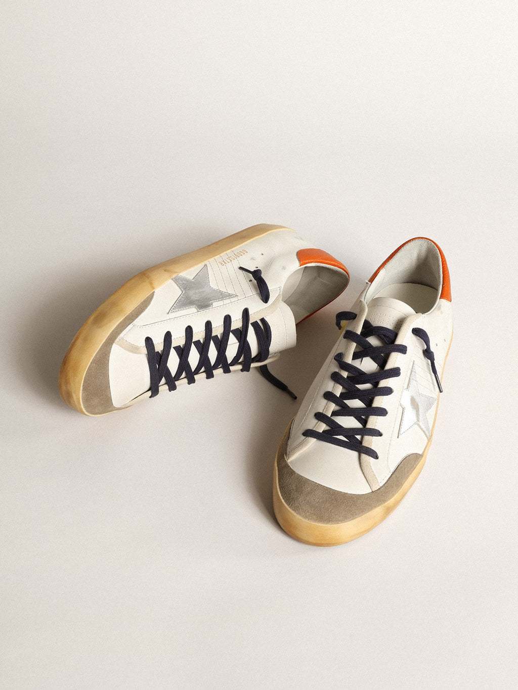 Super-Star Penstar with silver star and orange heel tab| Golden Goose