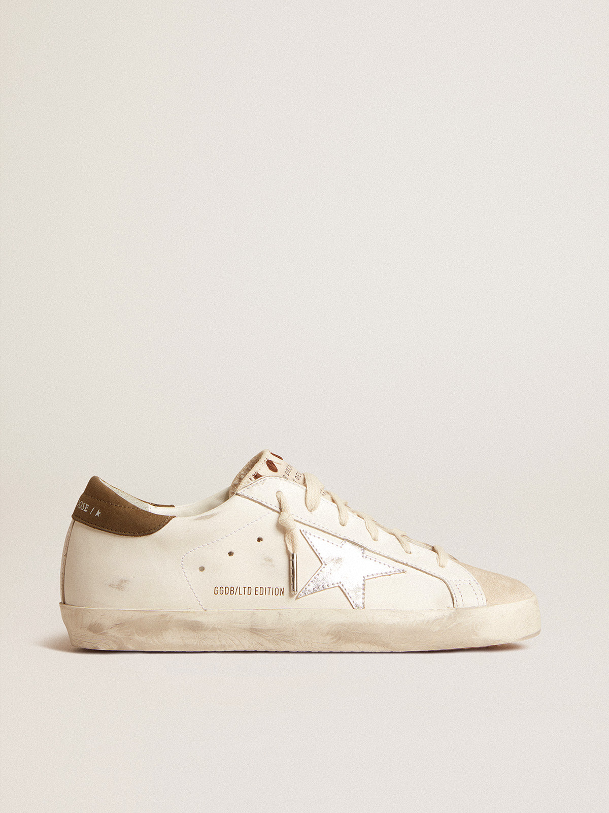 Super-Star LTD with metallic silver leather star and brown heel tab| Golden Goose