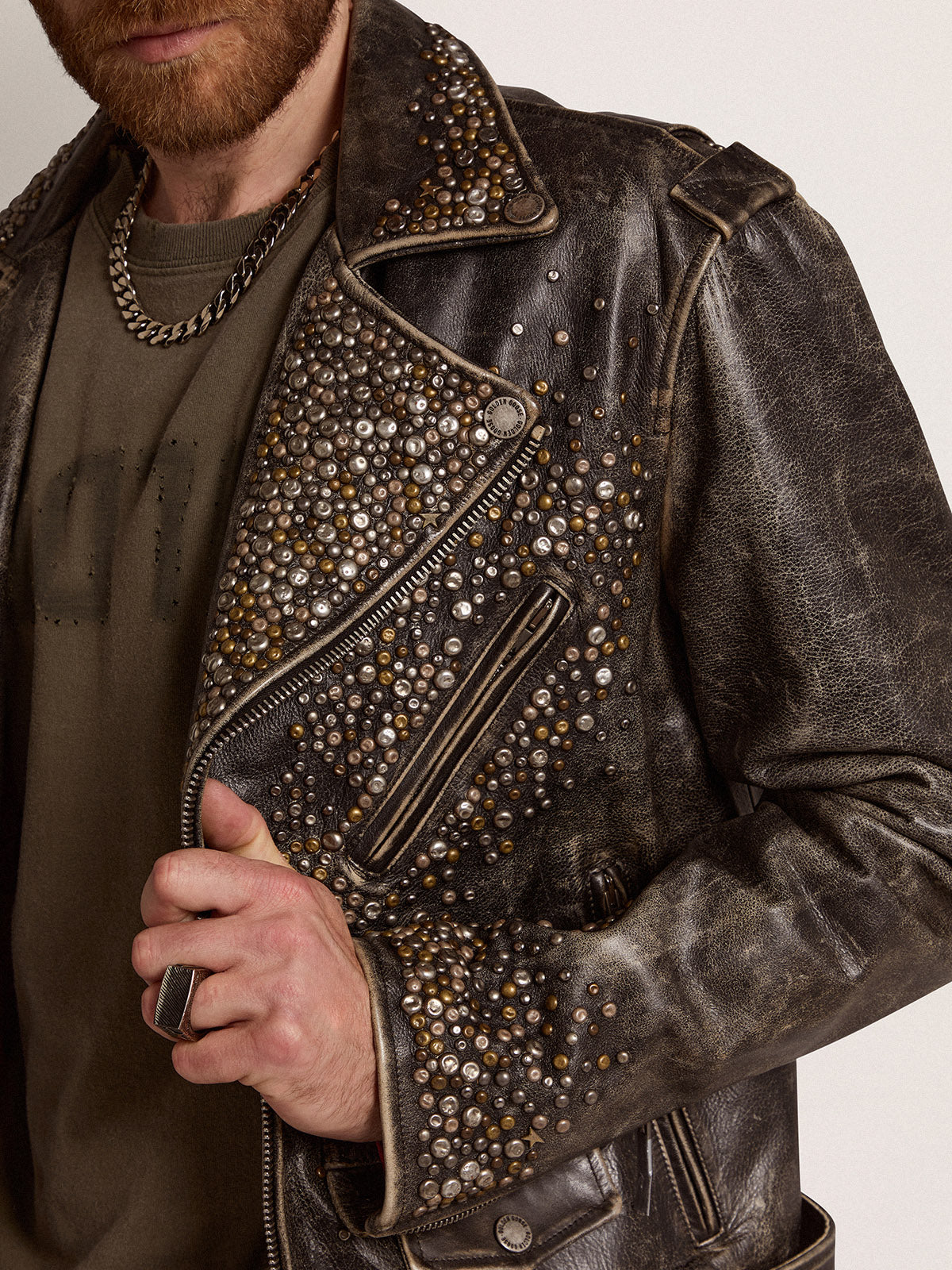 Men's leather biker jacket with hammered studs and adhesive tape| Golden Goose