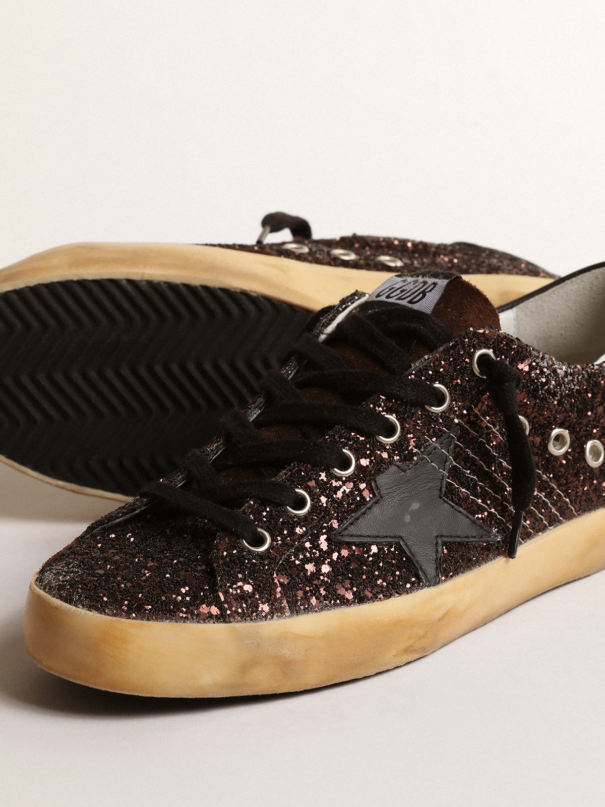 Super-Star in brown glitter with black leather star and heel tab| Golden Goose