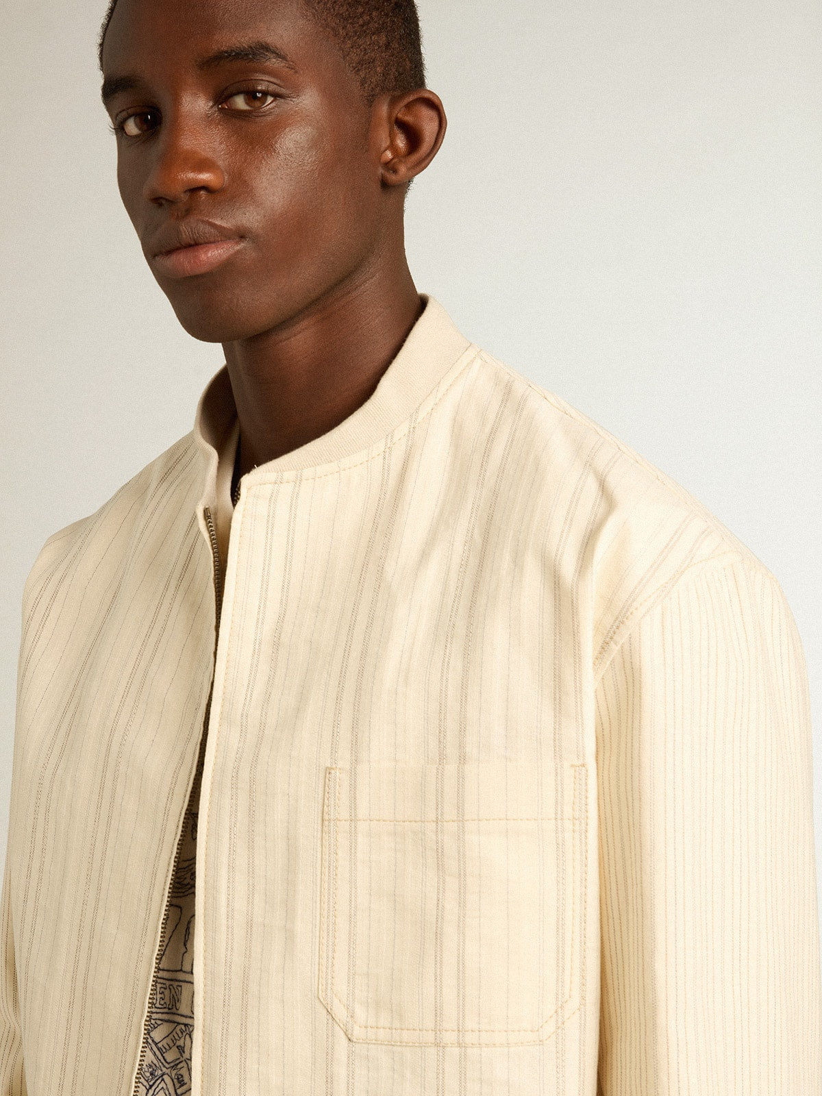 Ecru-colored cotton jacket with zip fastening