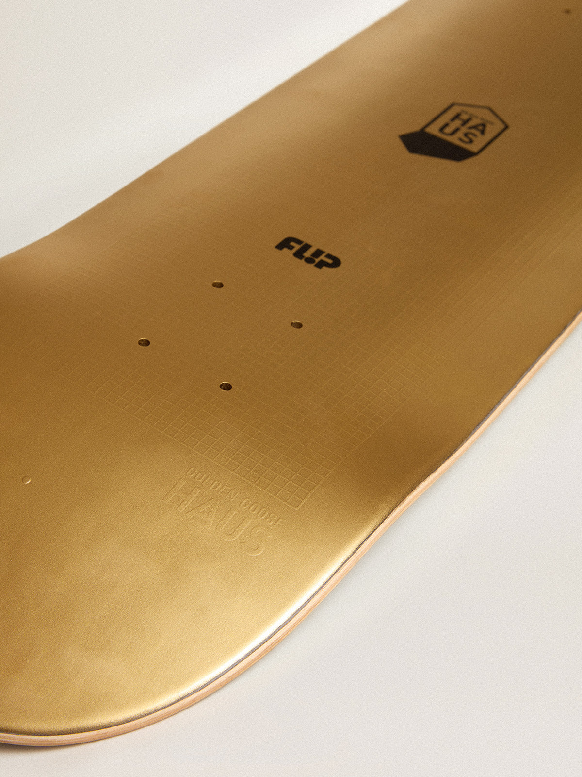 HAUS LTD skateboard with double layer in gold and black| Golden Goose